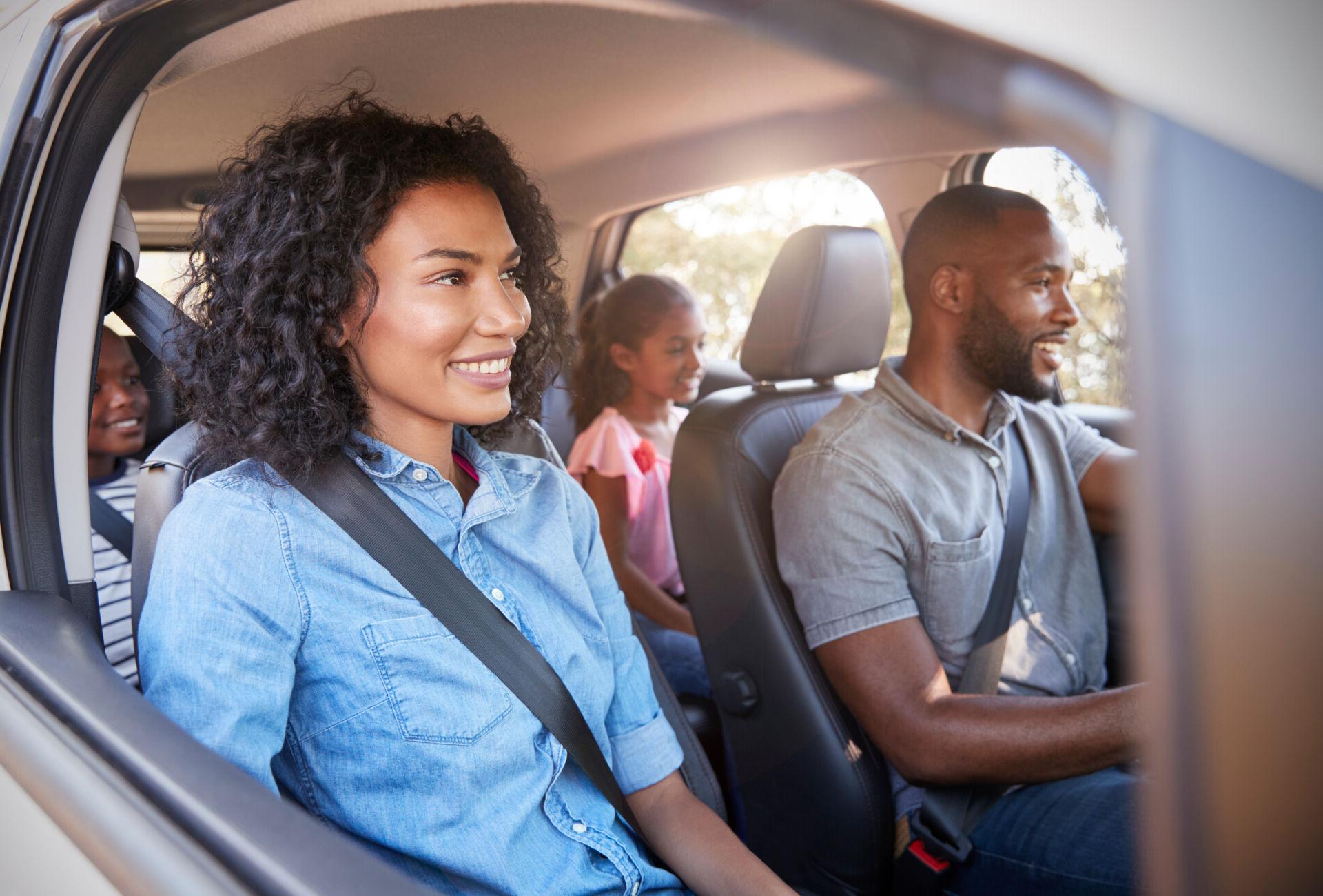 A family of four drives off happy after getting a credit union auto refinance.